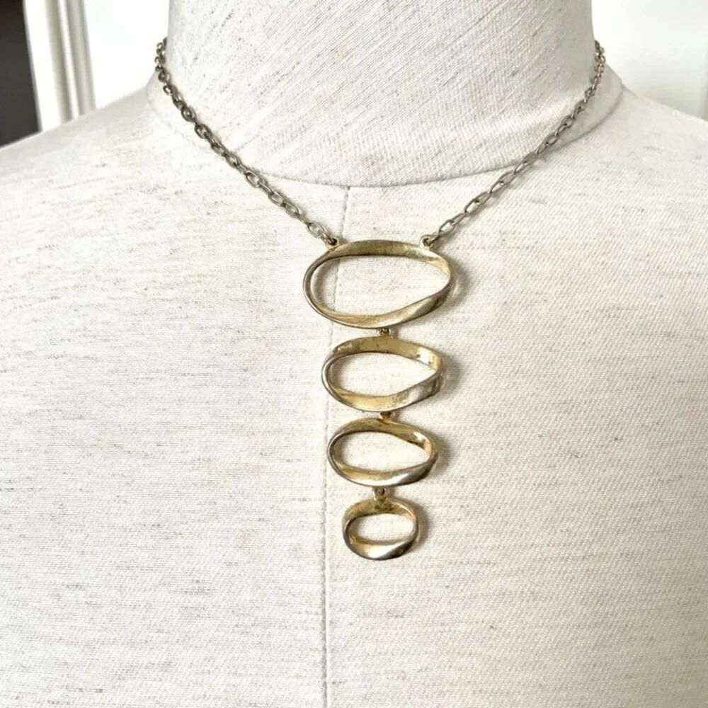 Axcess gold tone pendant necklace